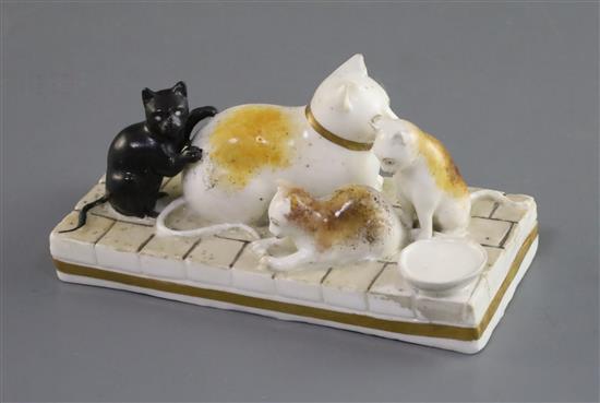 A Rockingham porcelain group of a cat and three kittens, c.1826-30, L. 11cm